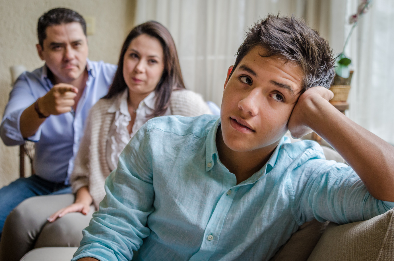 Young Boy being told off by parents